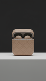 Taupe limited-edition wireless earbuds with magnetic closure packaging